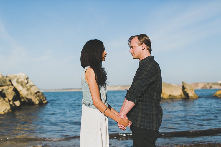 intimate exchange of vows at the beach in a small elopement in Portugal, by obidos wedding photographer jesus caballero destination spot surf Peniche, little california