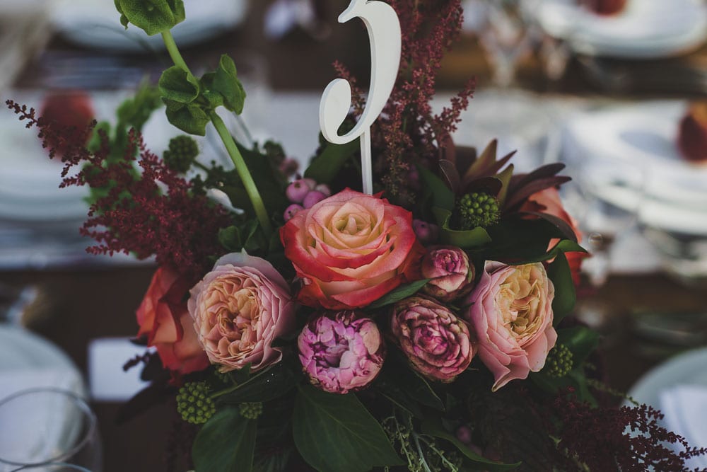 warm colour flower arrangements marsala wedding