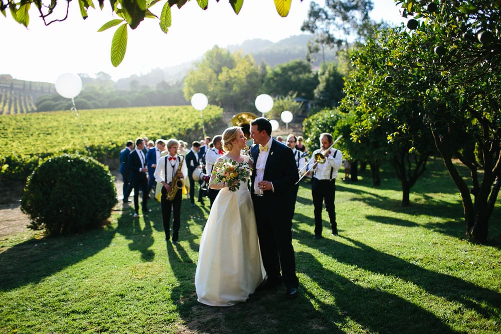 couple at vineyards during outdoor ceremony quinta santa ana wedding 