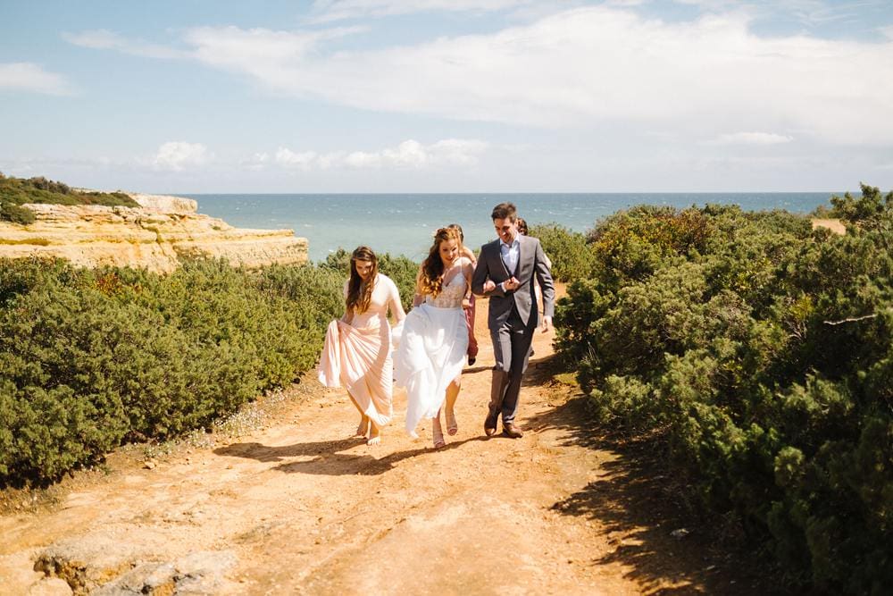 bride and groom with bridesmaids on the cliffs algarve www.jesuscaballero.com