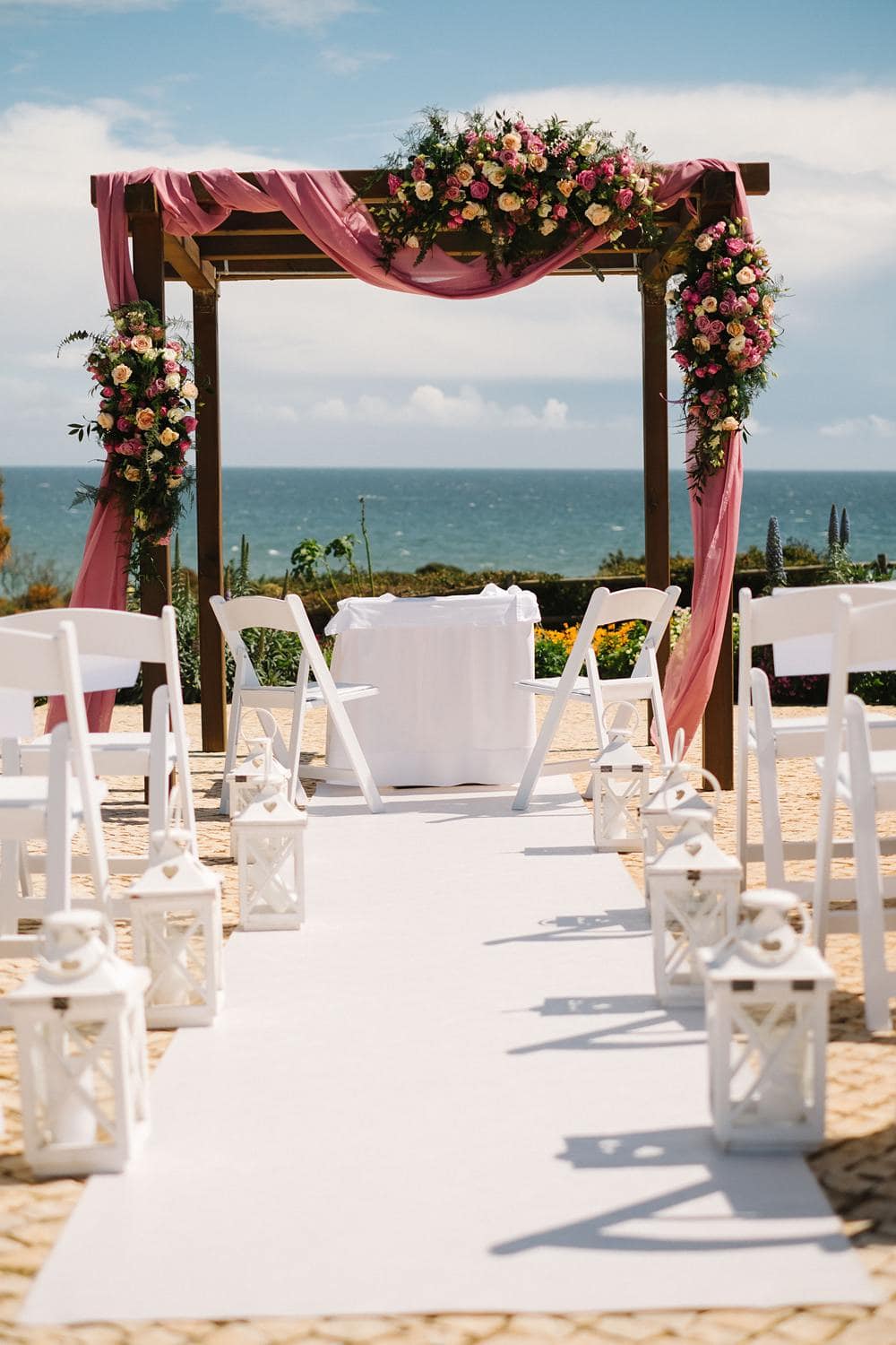 rustic wooden Floral Arch Viral Wedding Flowers pink yellow rose garden, ceremony backdrop, flower arc, garden wedding, pink wedding inspiration , blush wedding inspiration suites alba resort in Algarve by the sea www.jesuscaballero.com
