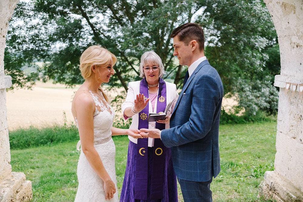 blessing at french countryside wedding by Simply Divine Ceremonies in Chateau Puissentut