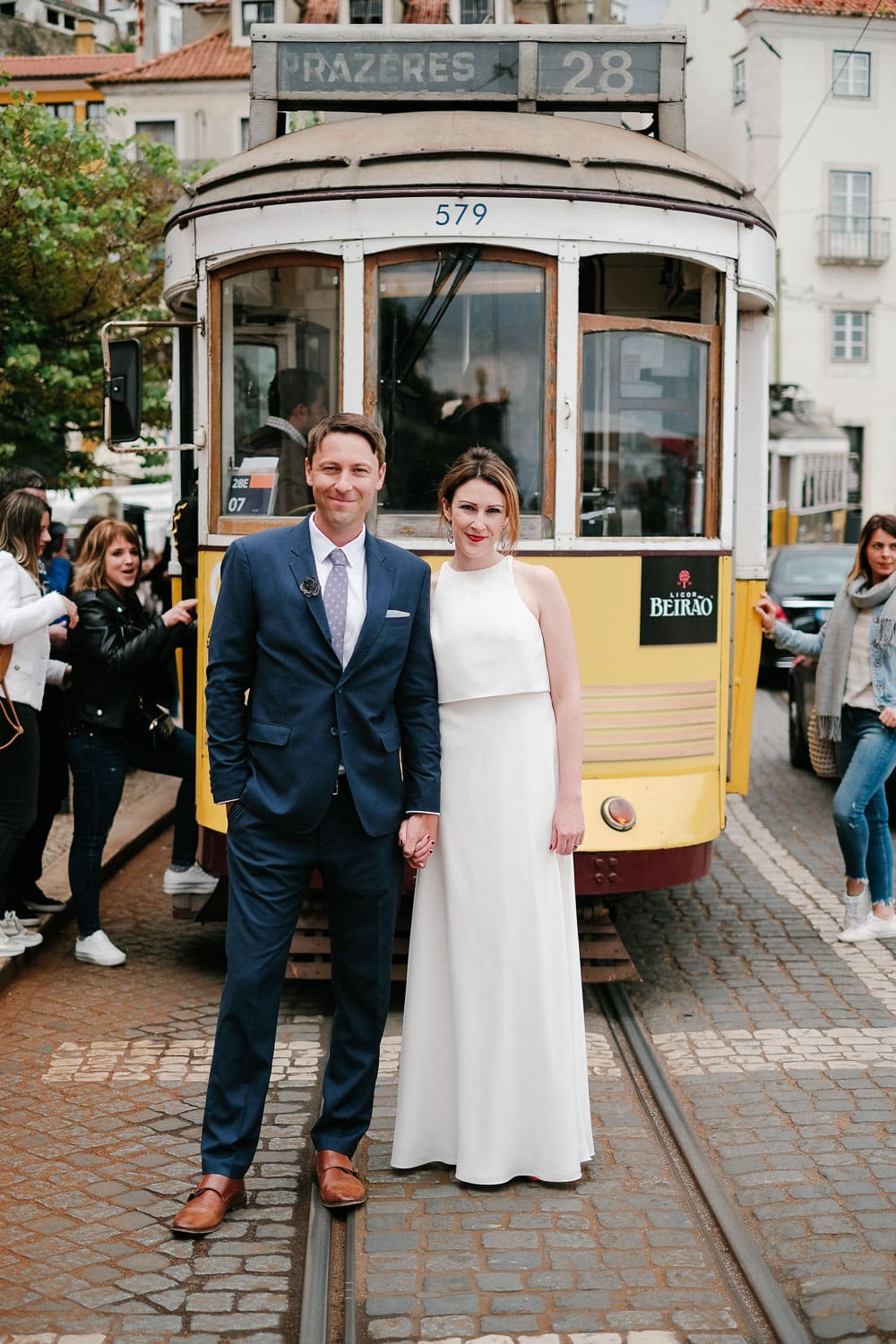 Wedding portraits for a couple in front of a Tram in Lisbon #tram #Lisbon #elopement #honeymoon #portugalwedding