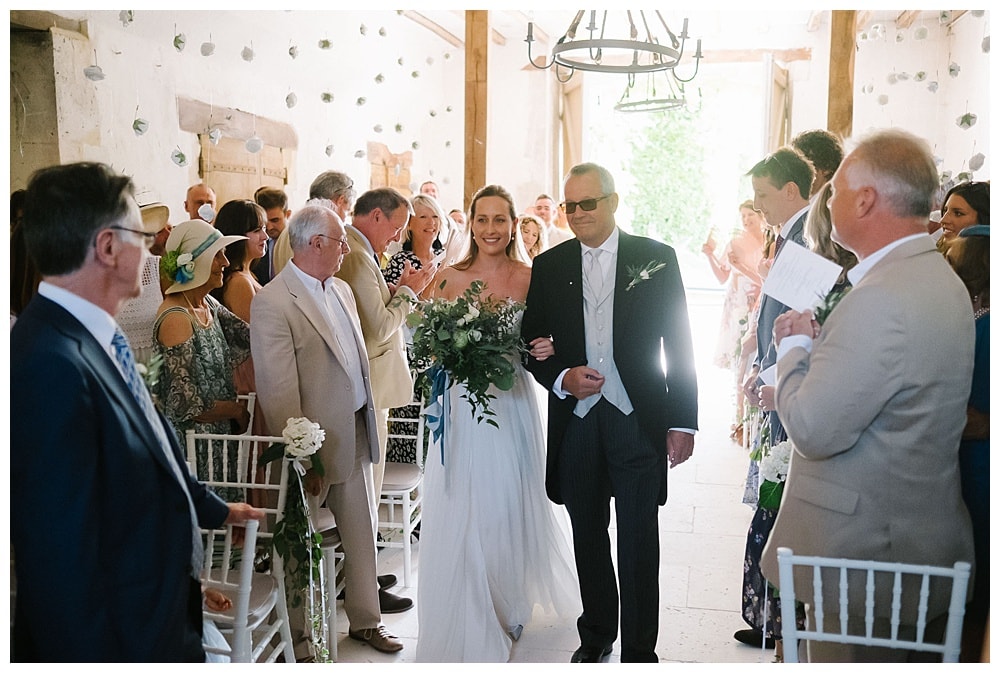 bride walking down the aisle at chateau wedding in south west france #chateaulagauterie #chateauwedding #marryinfrance #bride #franceweddingphotography #dordognewedding #bergeracwedding #frenchwedding #southwestfrancewedding jesuscaballero.com