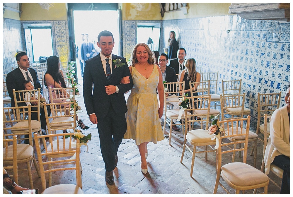 groom and mother wolking down the aisle in quinta vintage