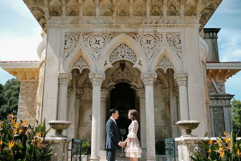romantic facade in monserrate palace with a couple in front looking directly on their eyes