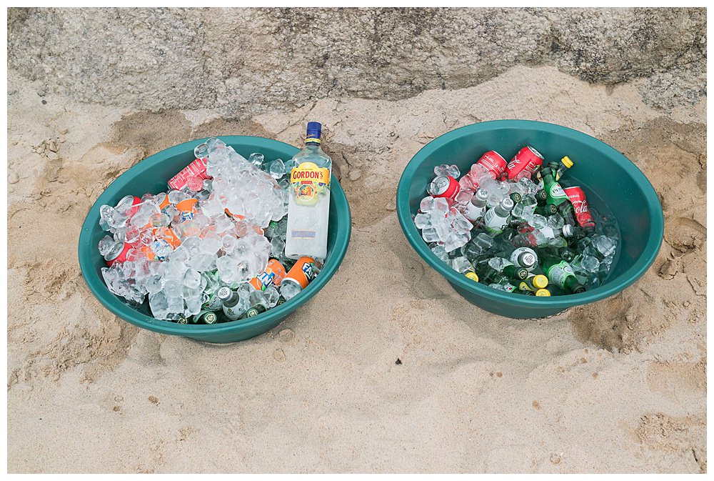 buckets with ice and cold drinks refreshments at the beach