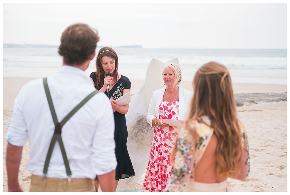 officiants at surf wedding at the beach in sand dunes Peniche
