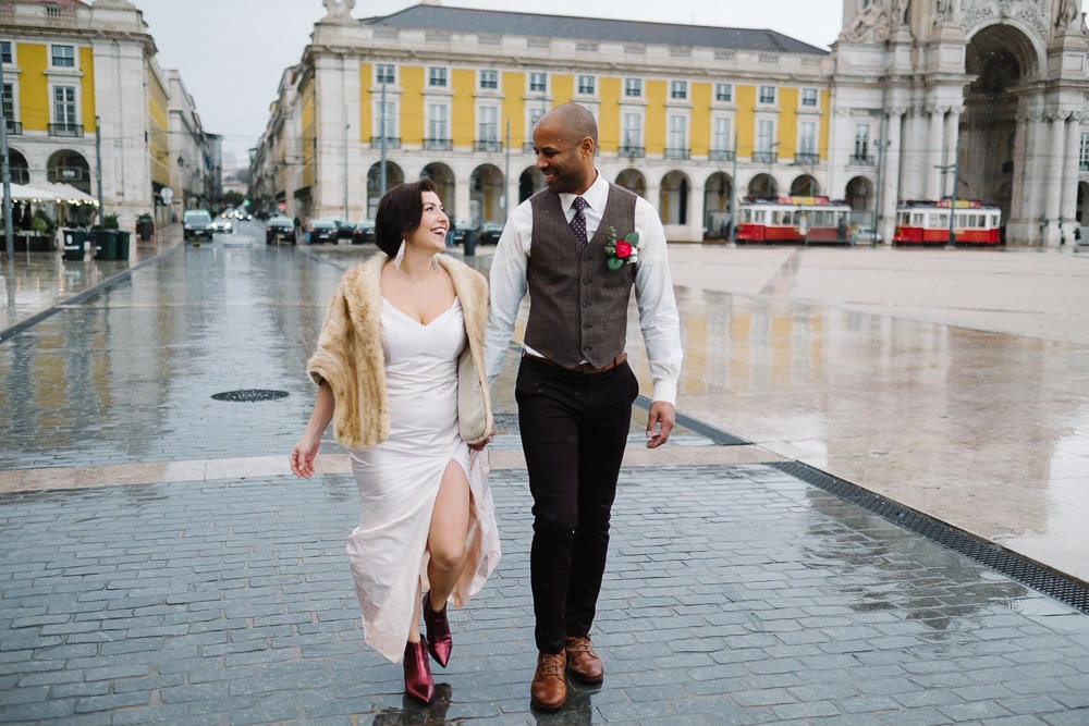 couple at the commerce square in lisbon