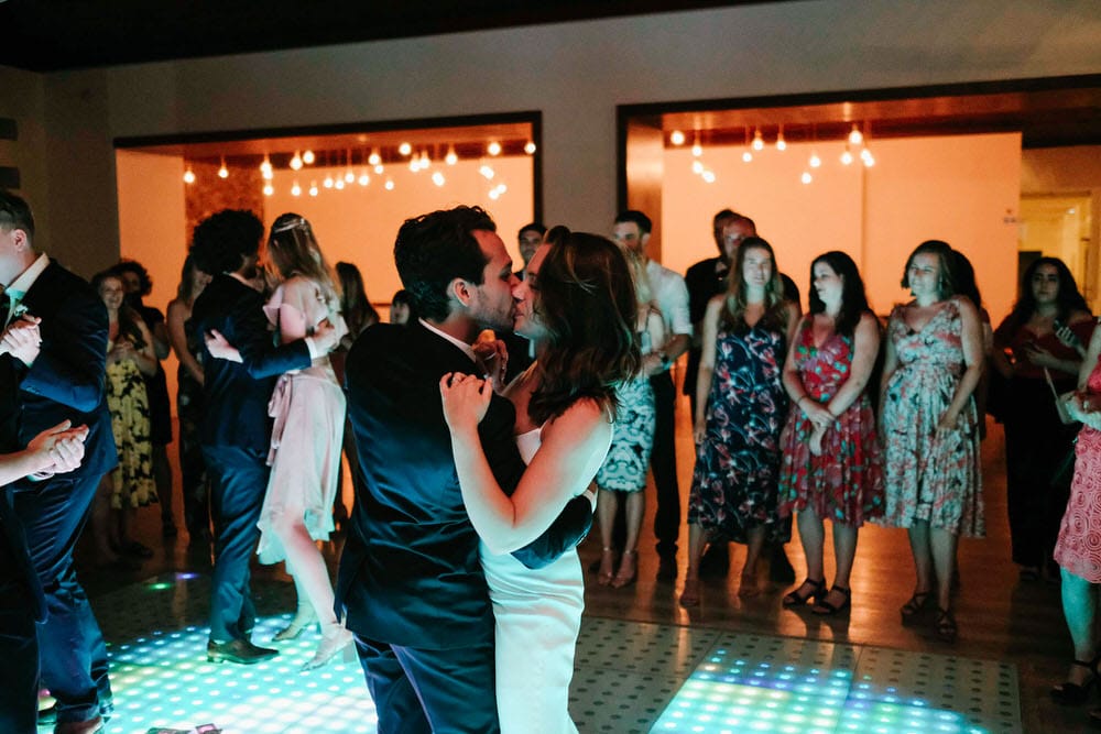 The newlywed couple showcasing their style with beauty during the first dance on the LED dance floor at Quinta da Bichinha