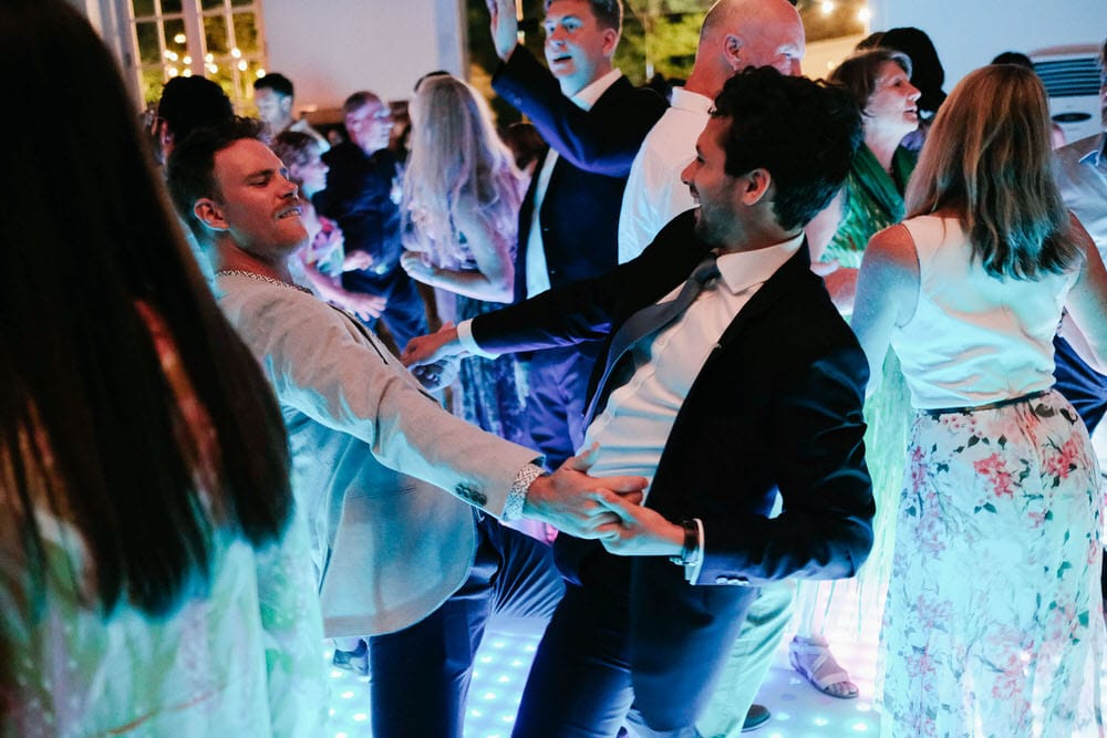 Groom and his friends dancing on the LED dance floor at Quinta da Bichinha