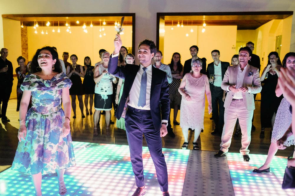 Groom and his friends dancing on the LED dance floor at Quinta da Bichinha
