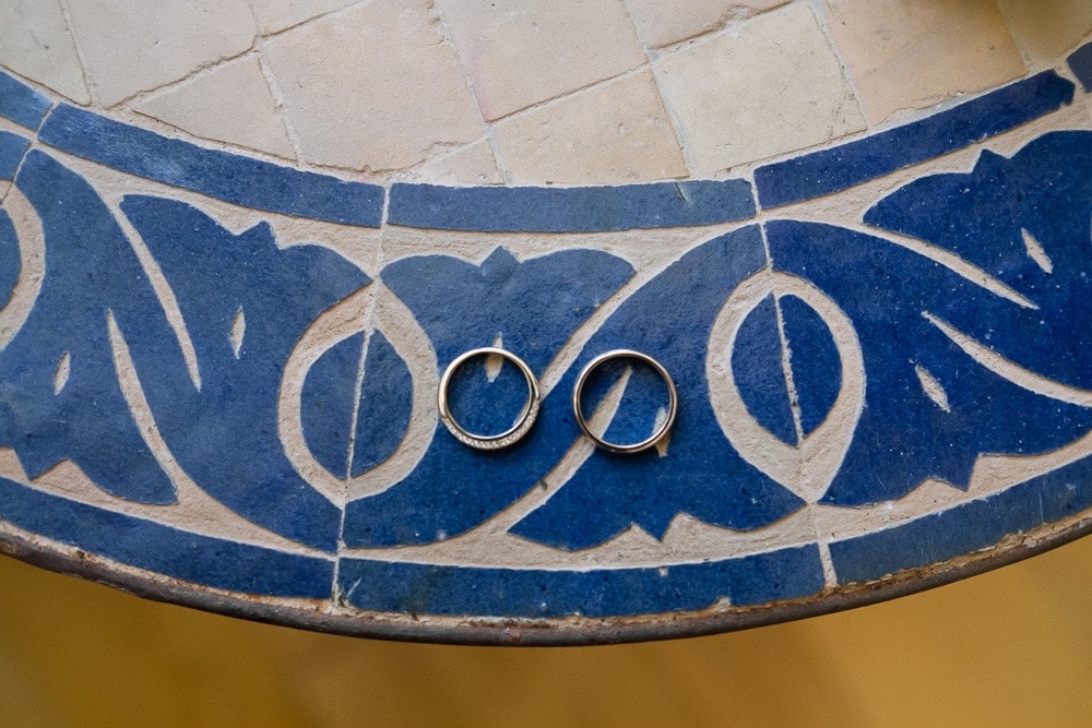 wedding bands on blue portuguese tiles
