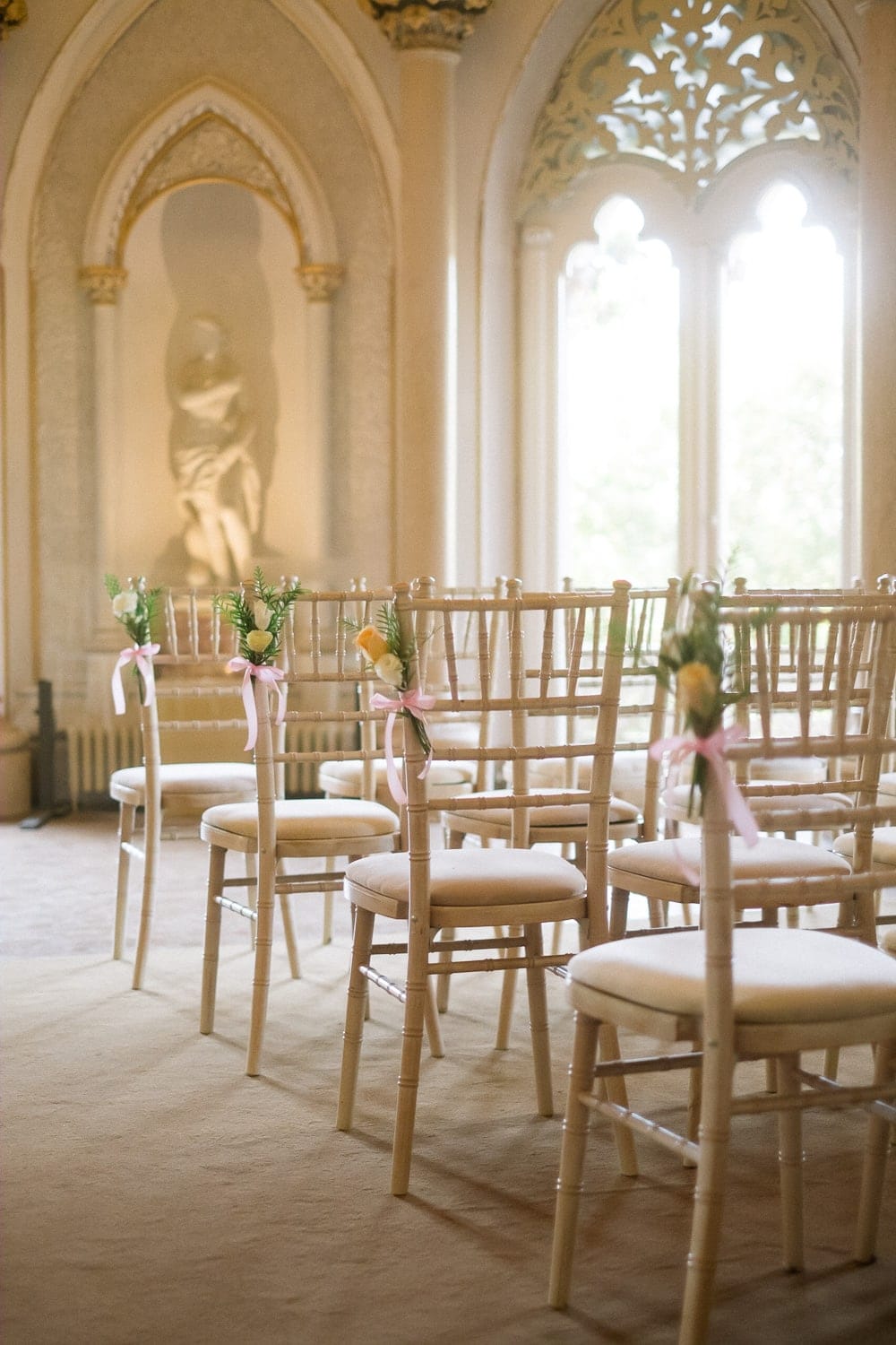 flower decoration on chairs during an American wedding at Monserrate Palace in Sintra