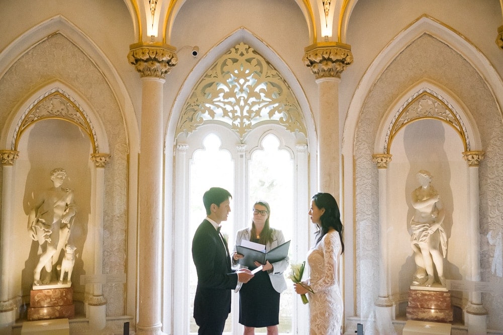 groom reading vows in front of the bride at the Monserrate Palace in Sintra