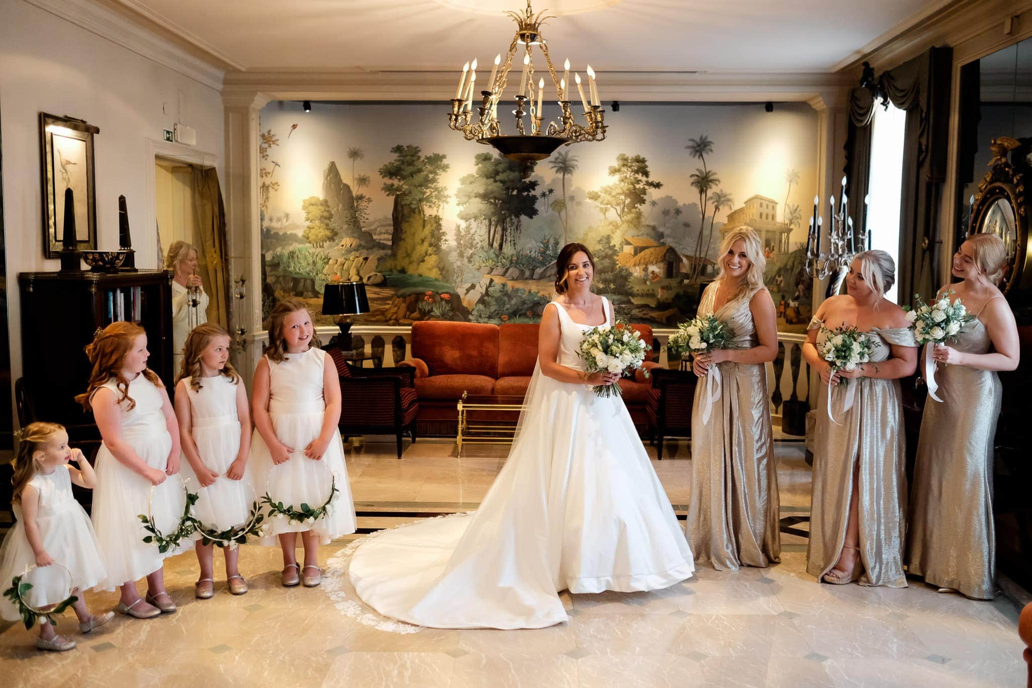portrait of bridesmaids and bride and flower girls in palacio Estoril hotel wedding