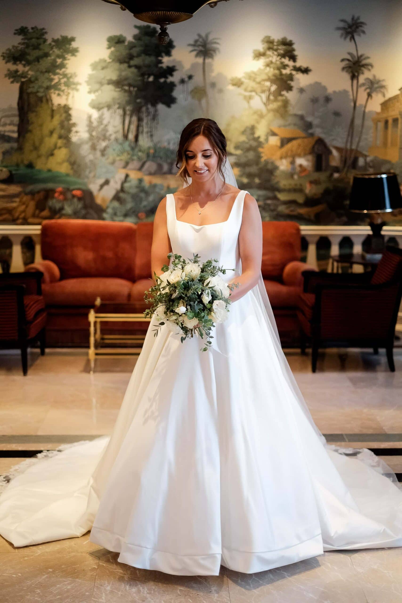 portrait of bride with stunning dress and bouquet at Palacio Estoril hotel