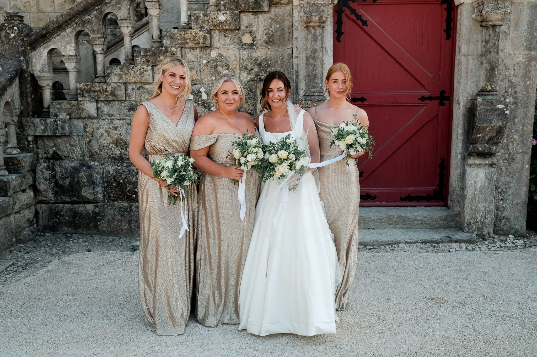 bridesmaids with champagne dress color with bride at Forte da Cruz Wedding