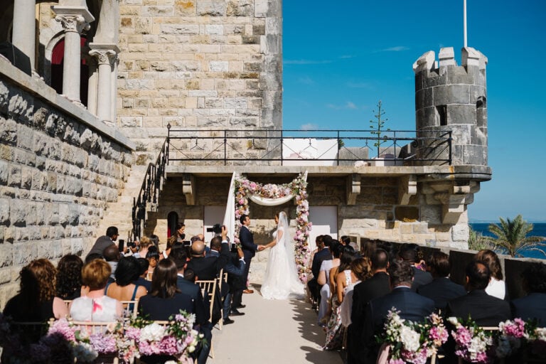 symbolic wedding ceremony at flower canopy in romantic forte da cruz wedding
